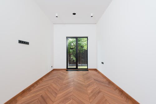 Free Wooden Floor and White Walls Inside a House Stock Photo