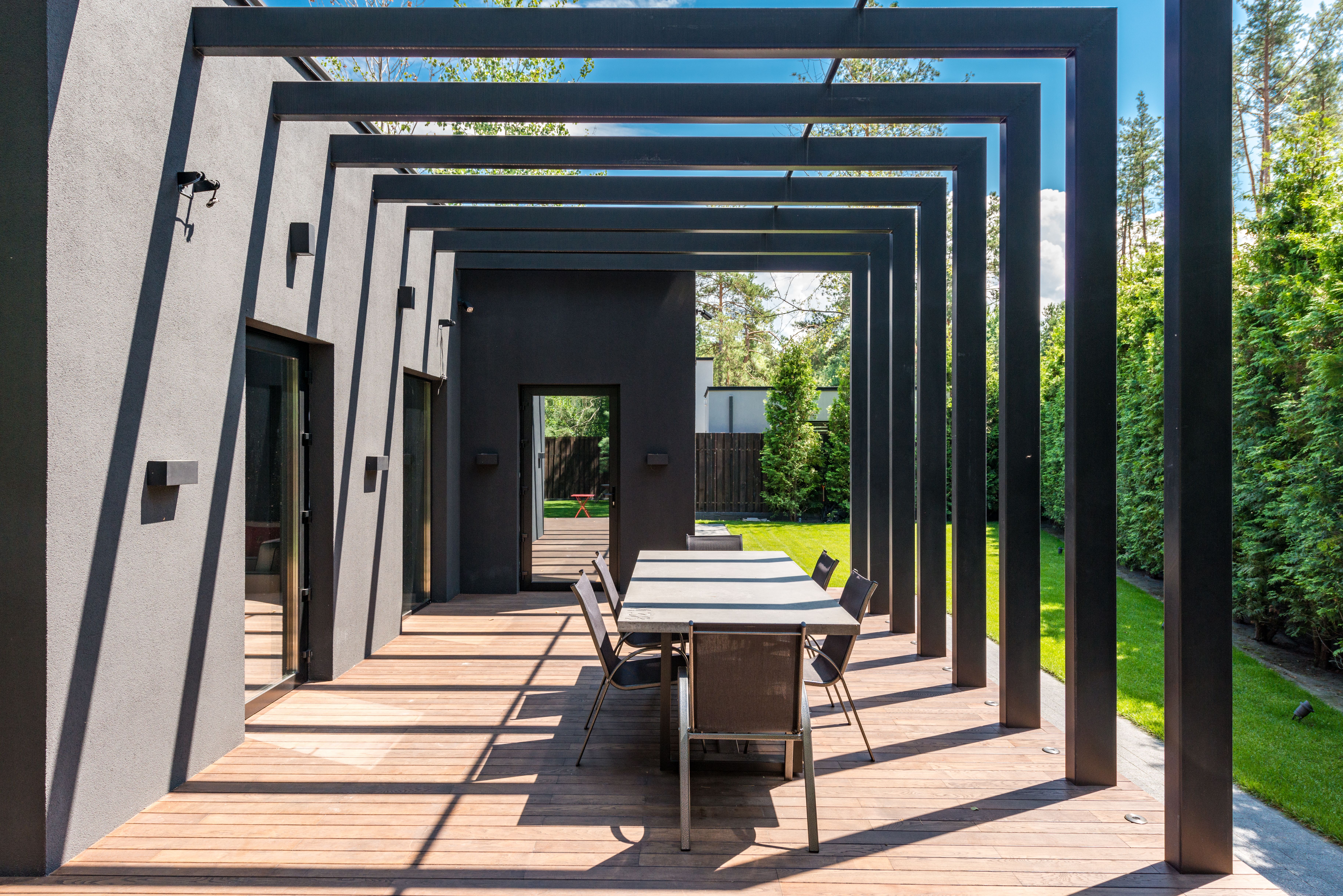 Modern pergola walkway linking shared outdoor spaces