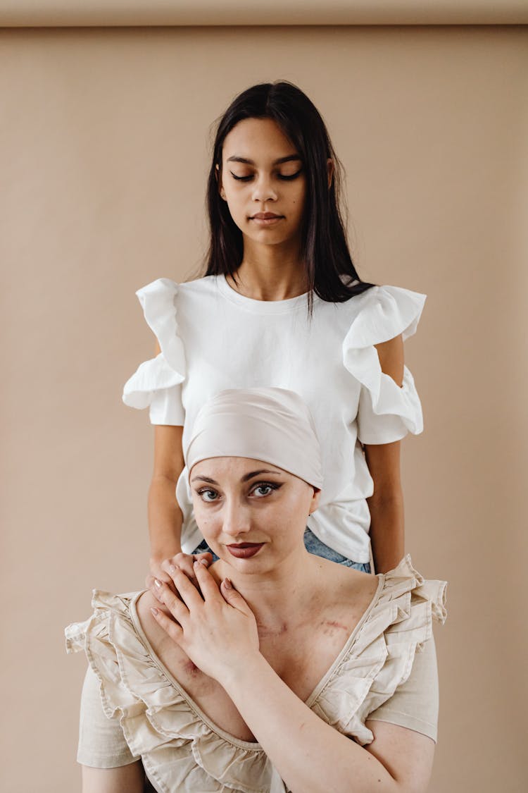 Studio Portrait Of A Mother With Her Daughter