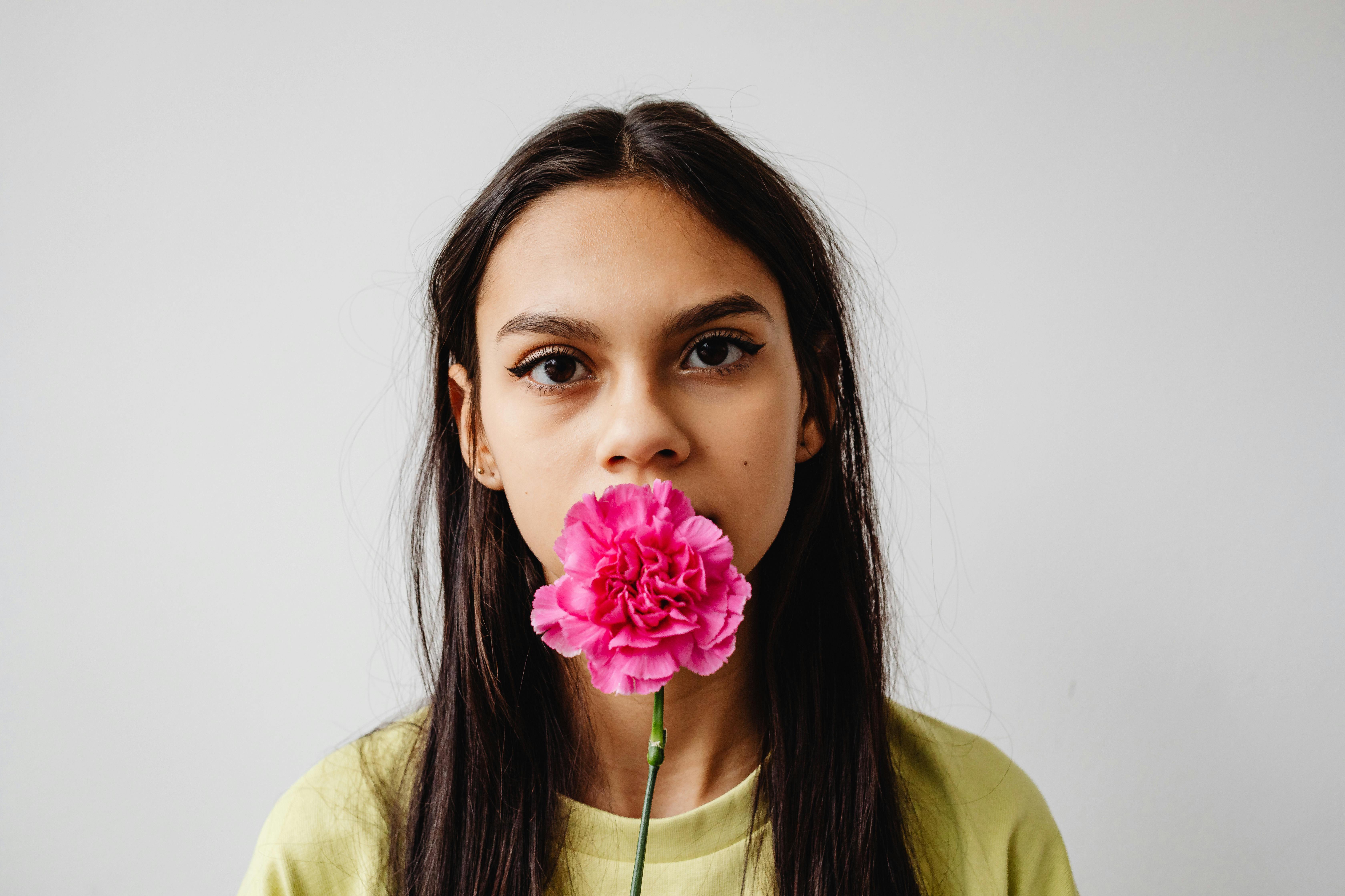 Portrait of Woman with Flower in Mouth · Free Stock Photo