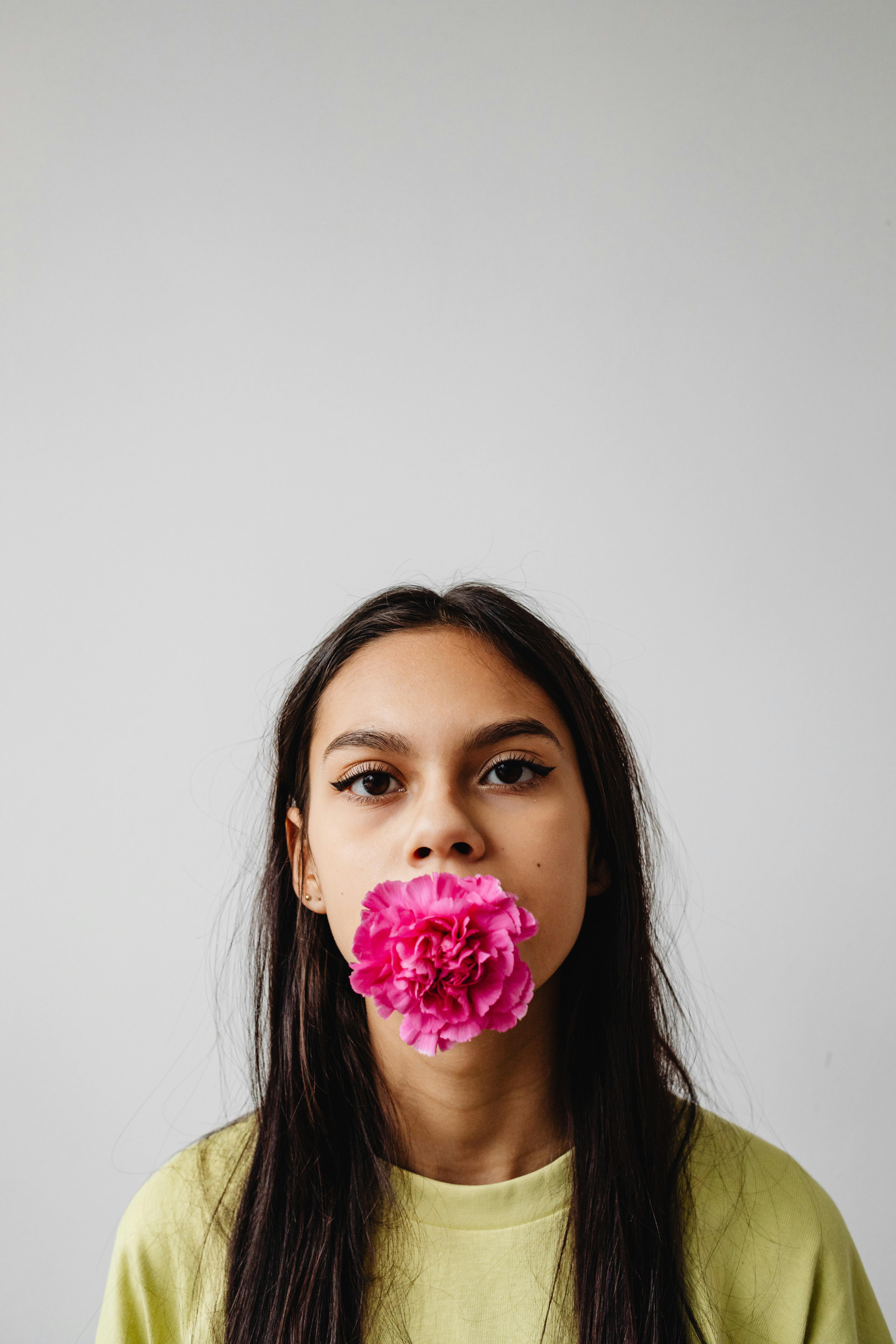 Portrait of Woman with Flower in Mouth · Free Stock Photo