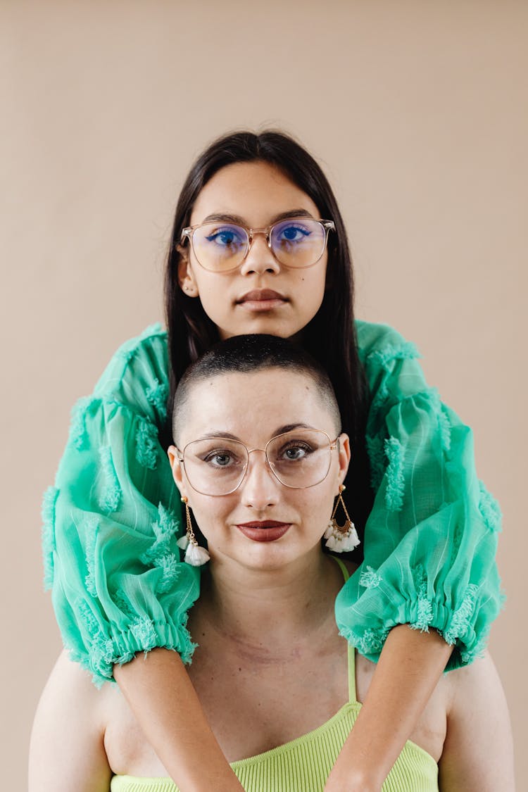 Studio Portrait Of A Mother And A Daughter