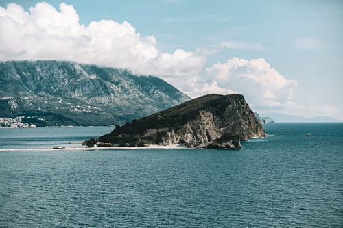 Free A breathtaking view of Sveti Nikola Island with mountains and ocean in Montenegro. Stock Photo