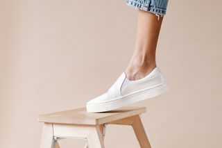 Low-profile court shoe on a warm studio backdrop — photo by Kaboompics on Pexels
