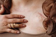 A Person Wearing a Gold Snake Ring