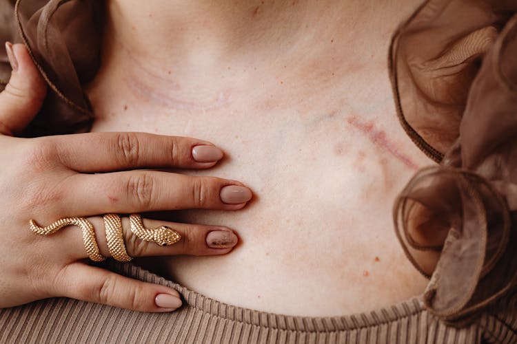 A Person Wearing A Gold Snake Ring