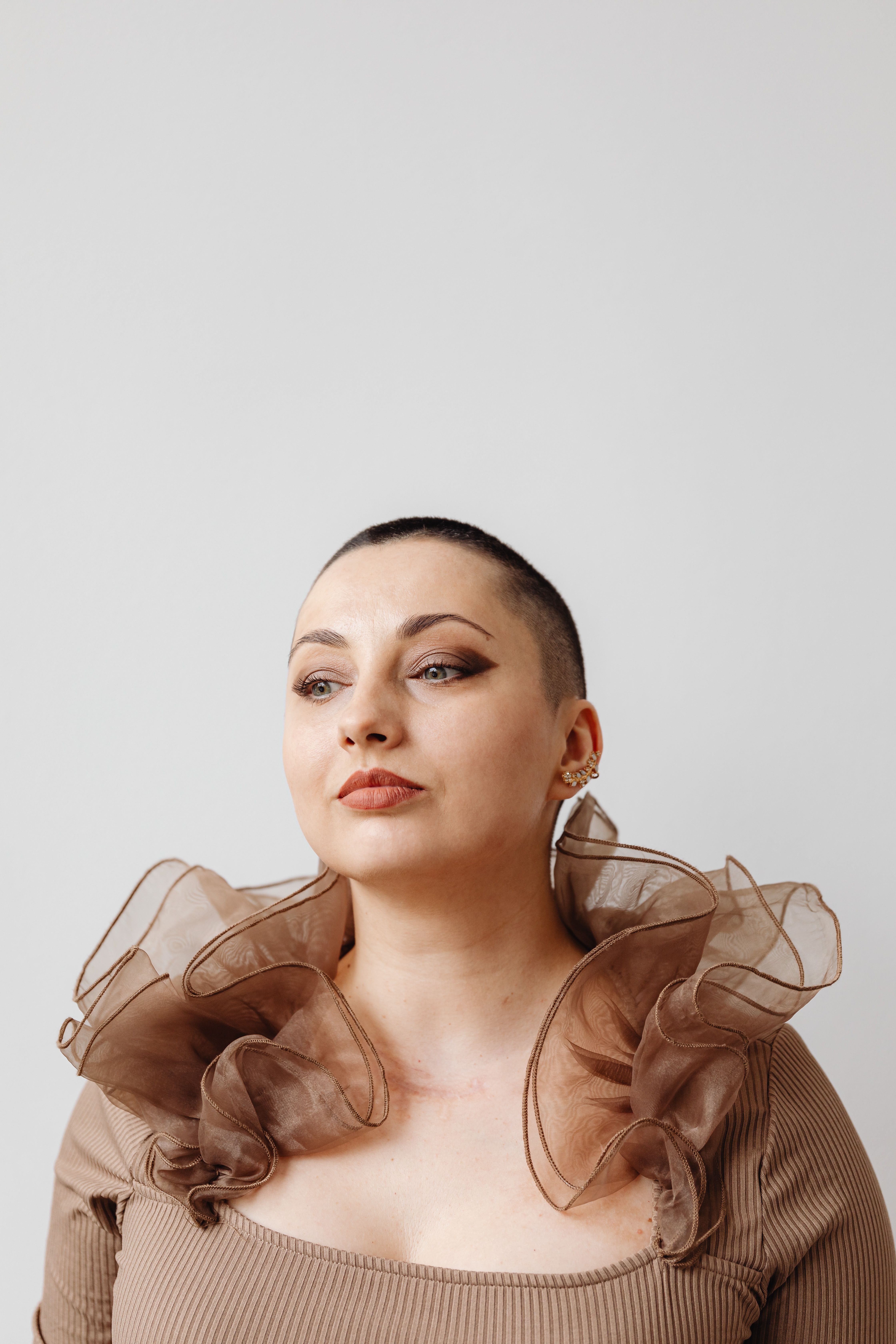 Studio Portrait of a Woman with a Shaved Head · Free Stock Photo