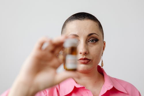 A Woman Holding a Bottle