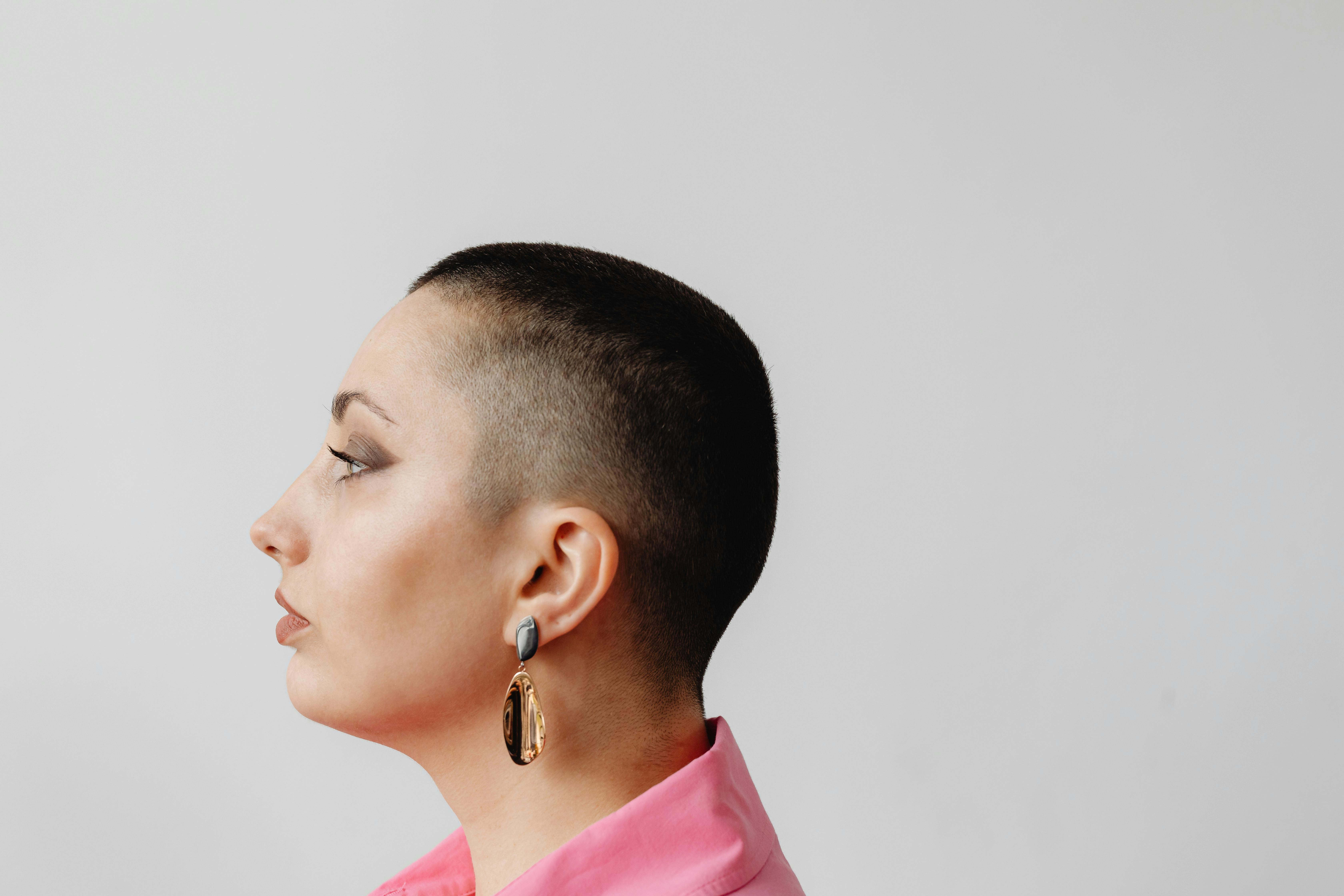 profile portrait of a woman with shaved head