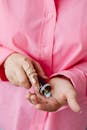 A Person Holding a Medicine Bottle