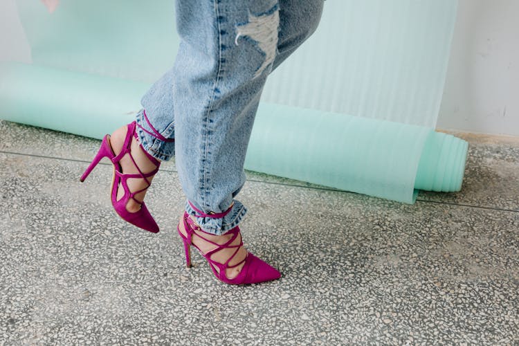 A Person Wearing A Purple Stilettos