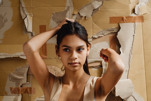 A Woman Tying Her Long Hair