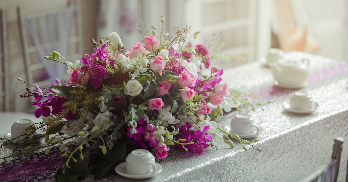 Pink and White Bouquet of Flowers on White Wooden Table