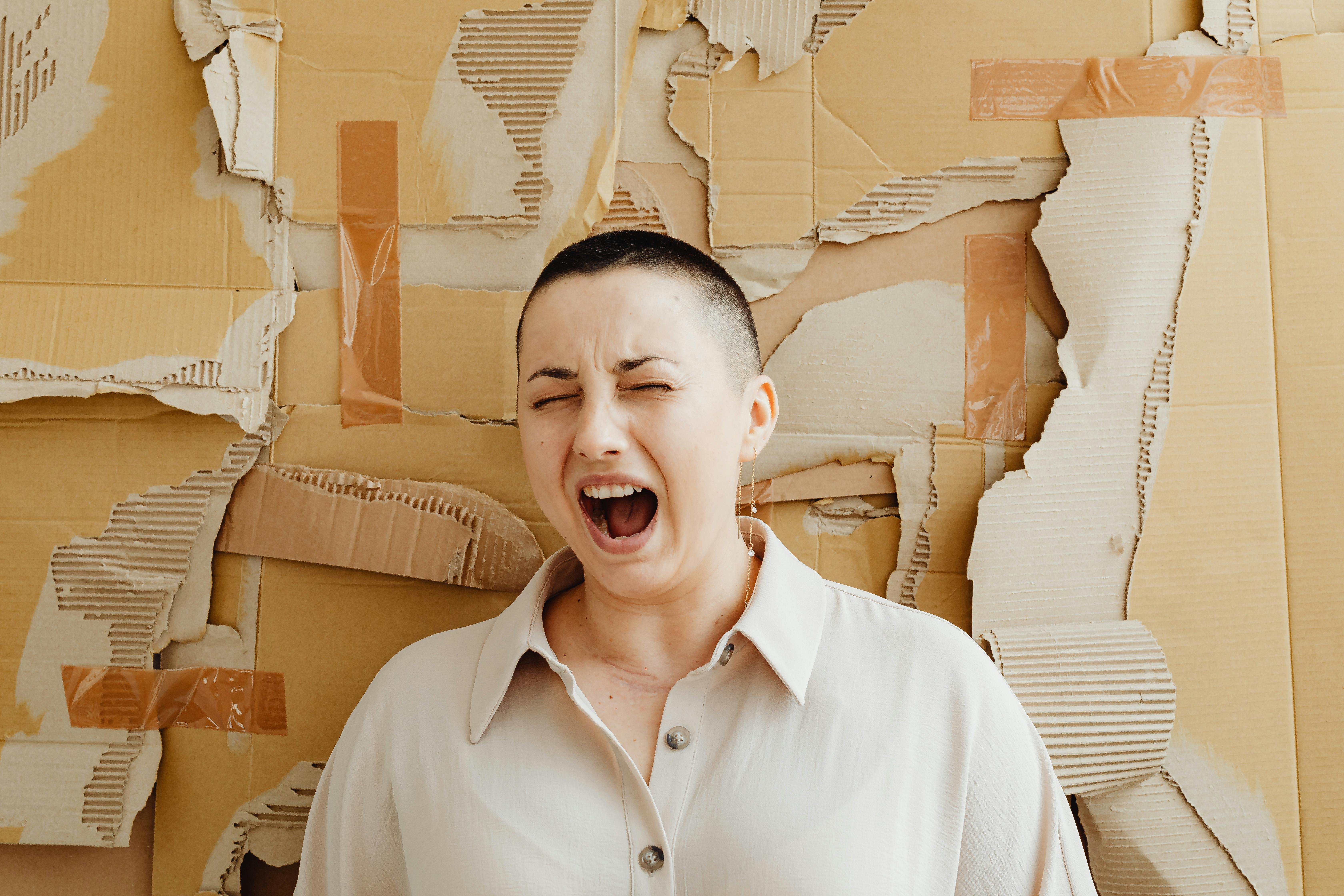 screaming person against cardboard