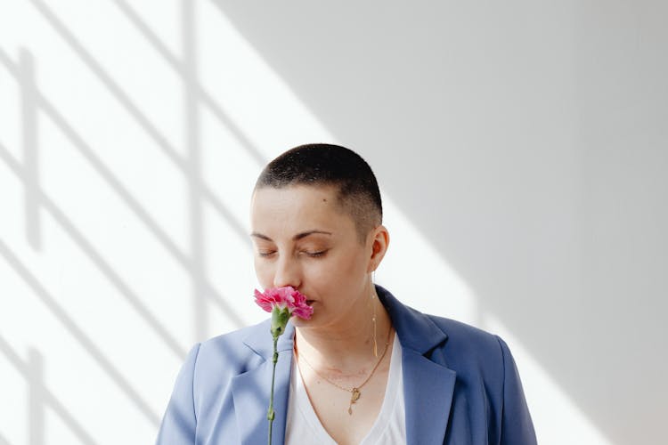 Woman Sniffing Flower