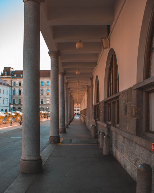 Free Sidewalk under Arcade Supported by Colonnade Stock Photo