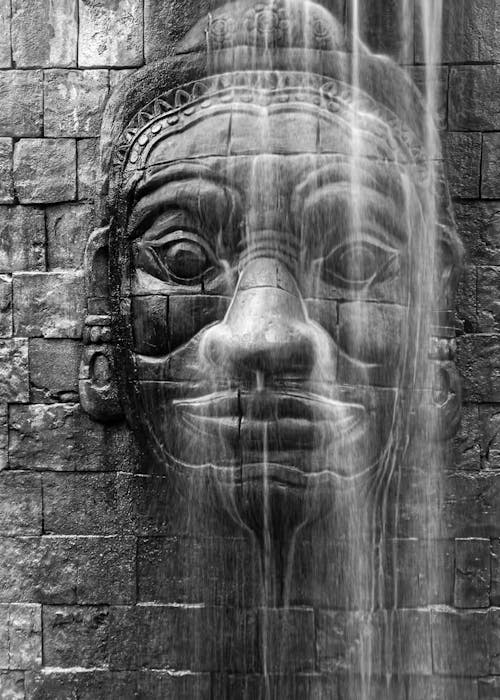 Monochrome Shot of a a Sculpture on the Wall