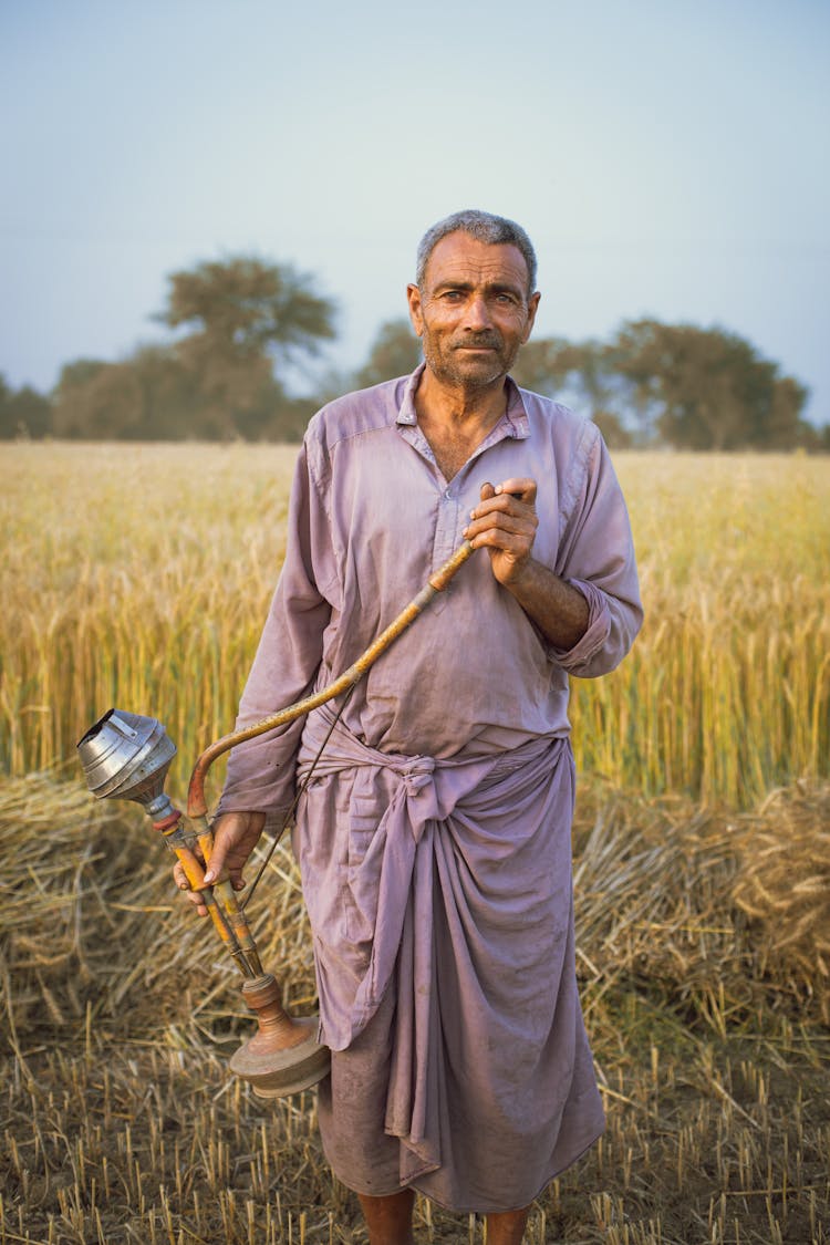 Portrait Of A Man Standing On Grass 