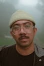 A Man Wearing Eyeglasses and Beanie
