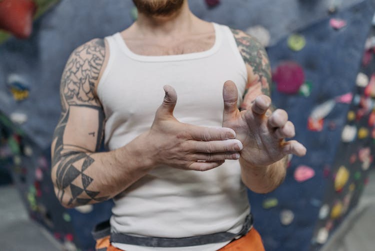 A Man In A White Sleeveless Shirt