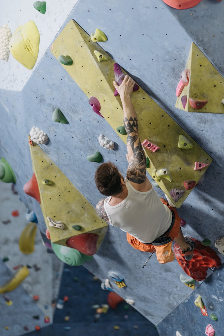 A Man Climbing On The Wall