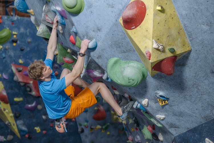 A Man Doing Rock Wall Climbing