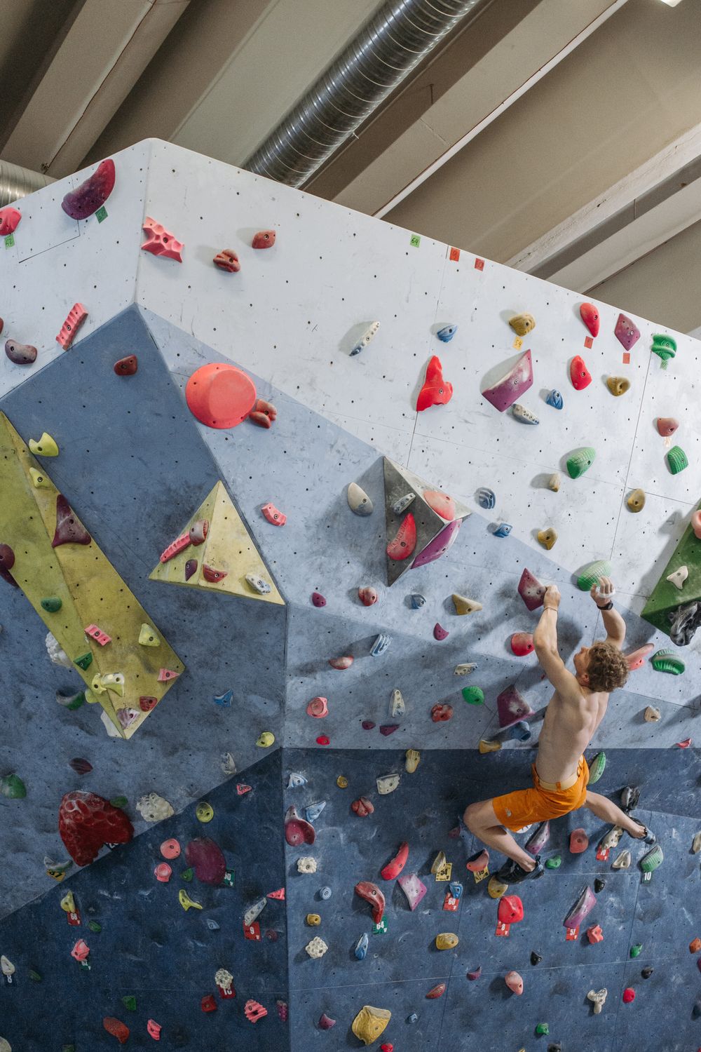 Climber reaching for a hold