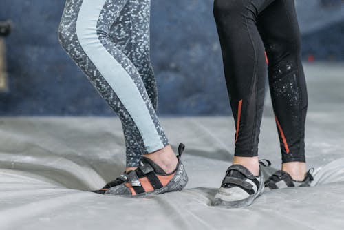 Two People wearing Leggings and Rock Shoes 