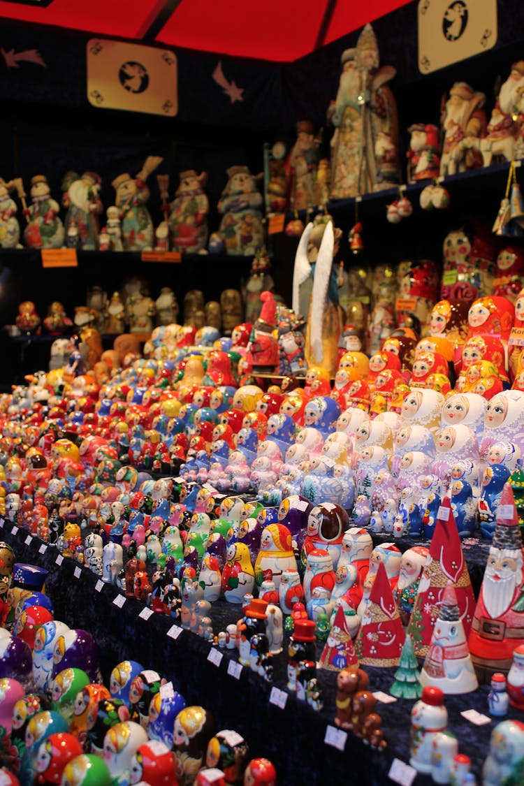 Wooden Figures On Market Counters