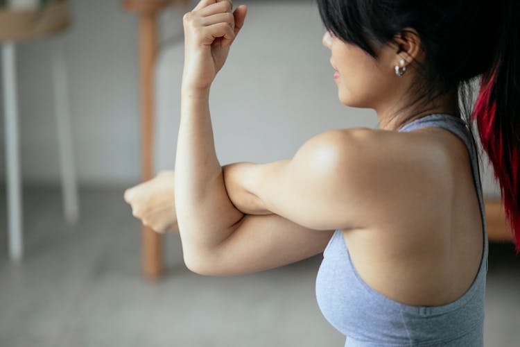 Woman Training Side Arm Stretching