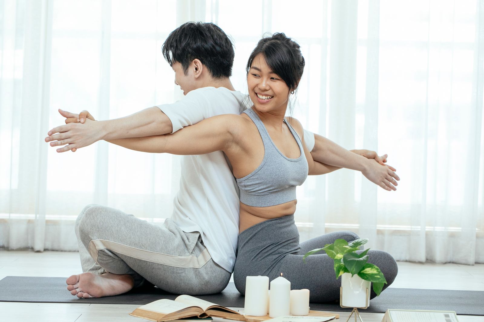 Bright home setting with a person gently holding their abdomen during a careful daily routine