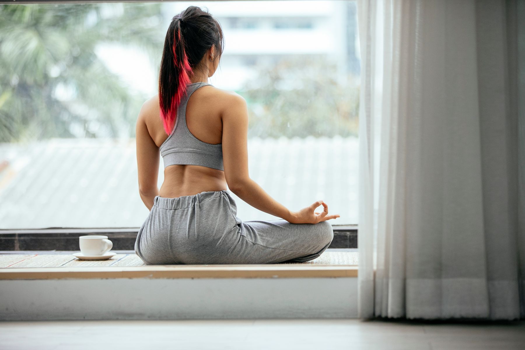 Person sitting in a calm cross-legged pose