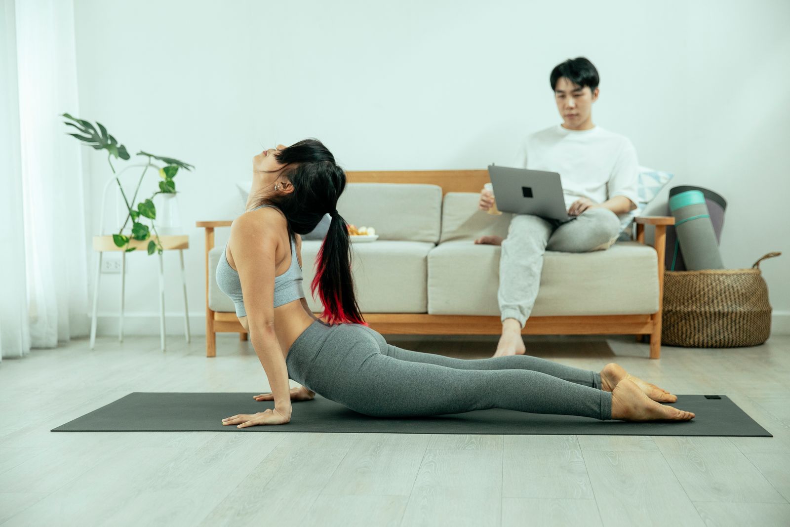 Woman doing a seated neck and shoulder stretch during a break from screen work