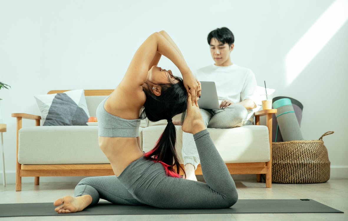 Free Photo  Concept of yoga exercises. young healthy couple in