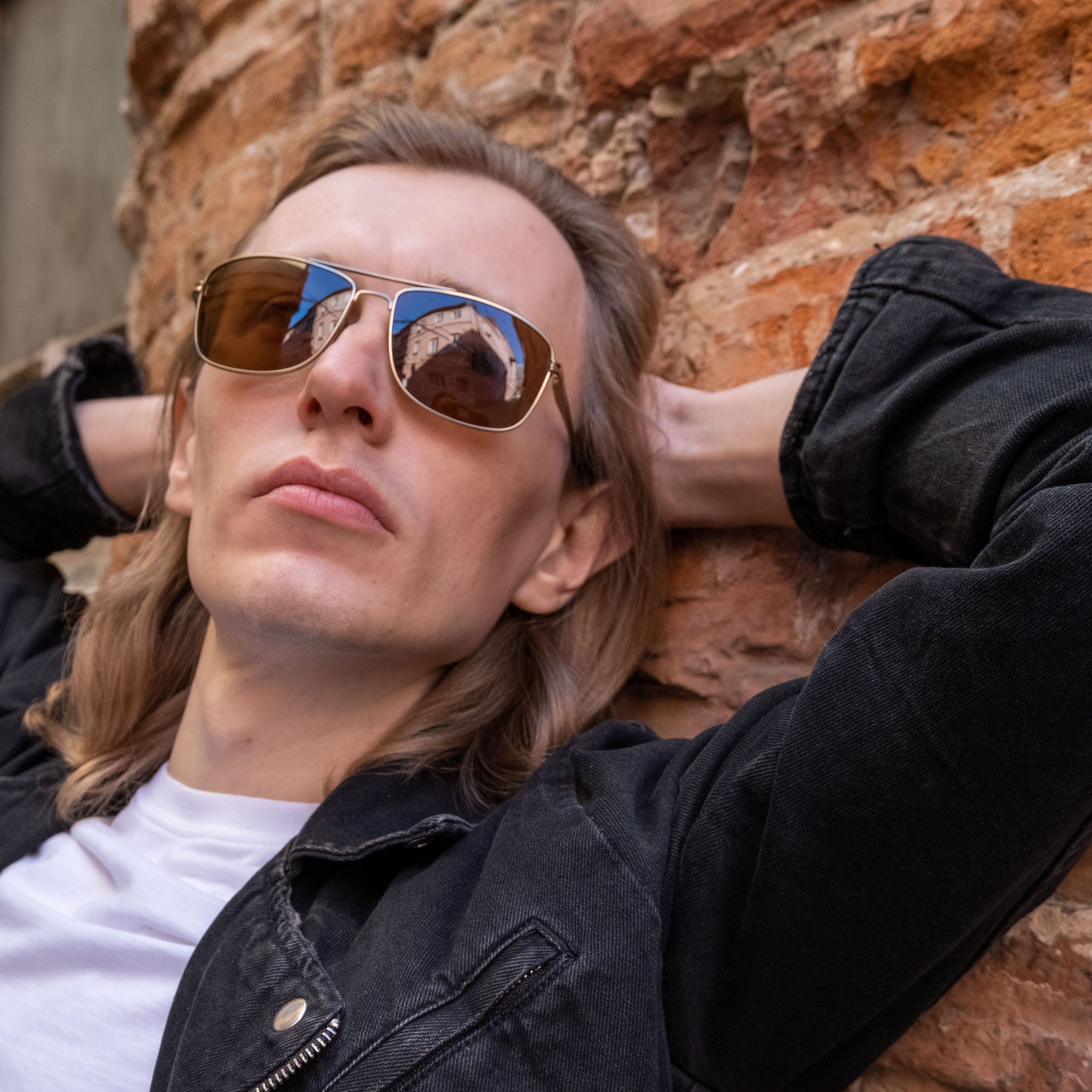 Woman in Blue Denim Jacket Wearing Sunglasses · Free Stock Photo