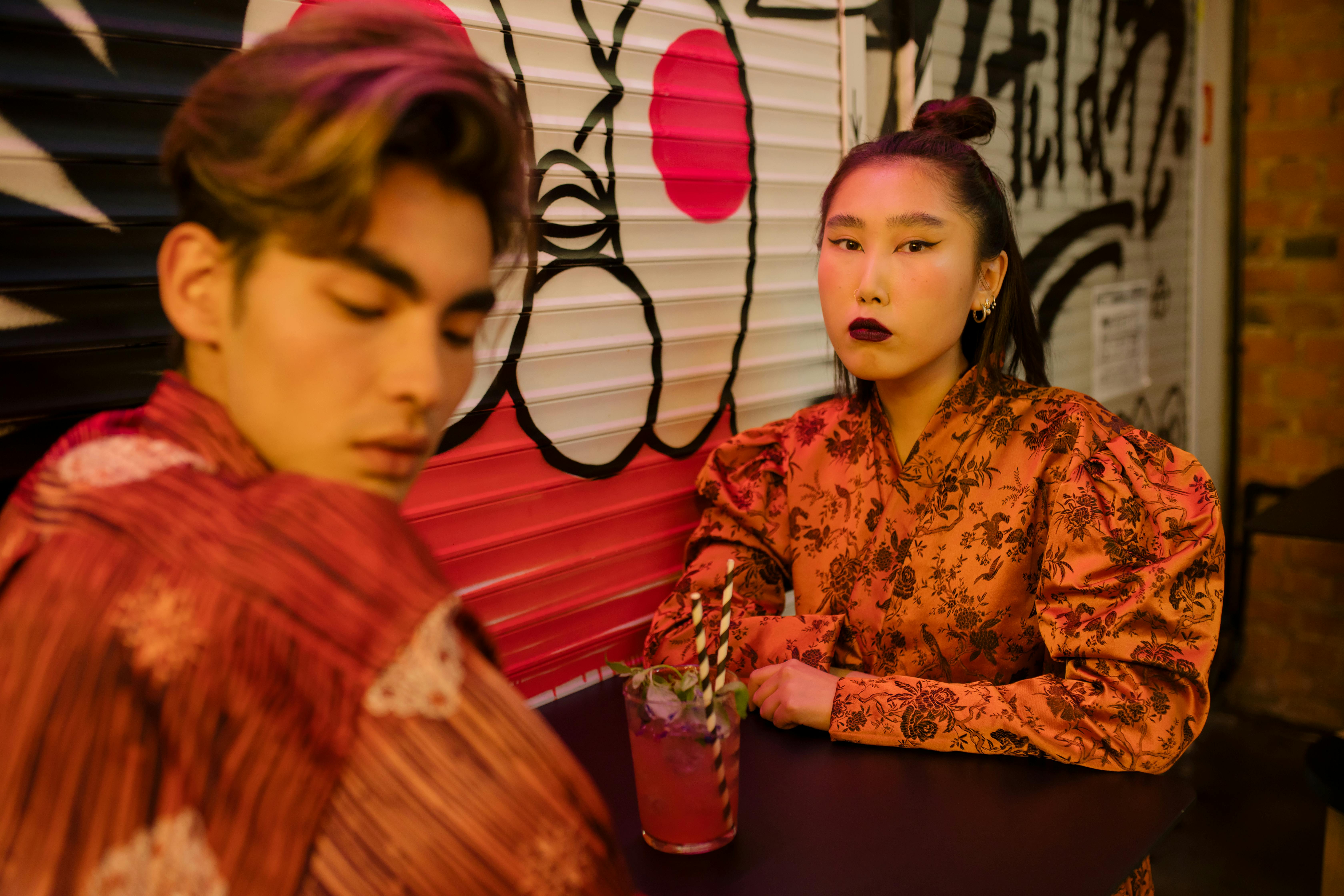 couple sharing a glass of juice