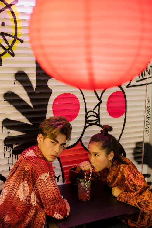 Couple Drinking from a Glass