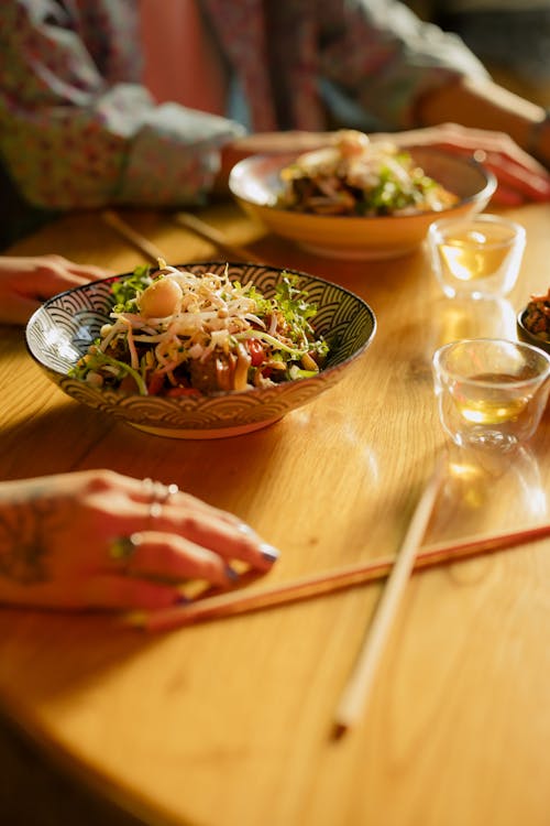Bowl of Noodles on Wooden Table
