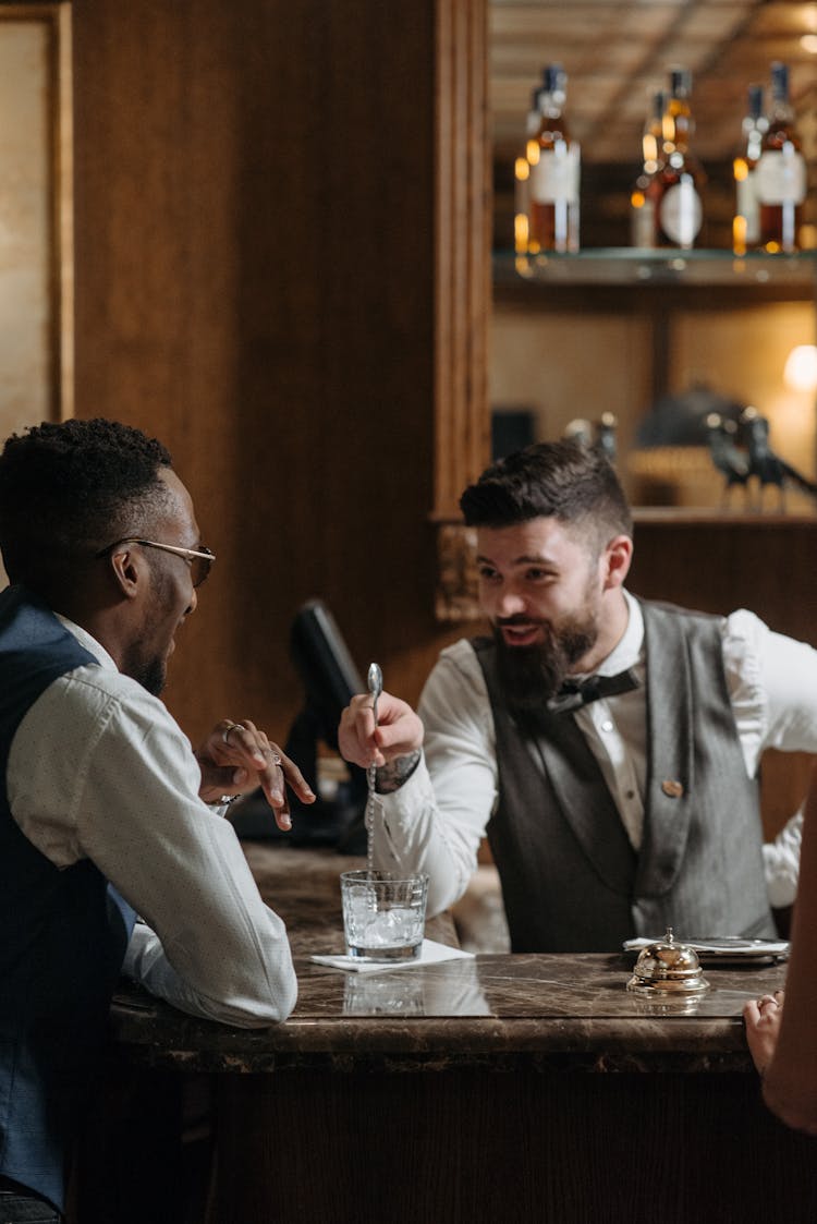 Man Talking To A Bartender