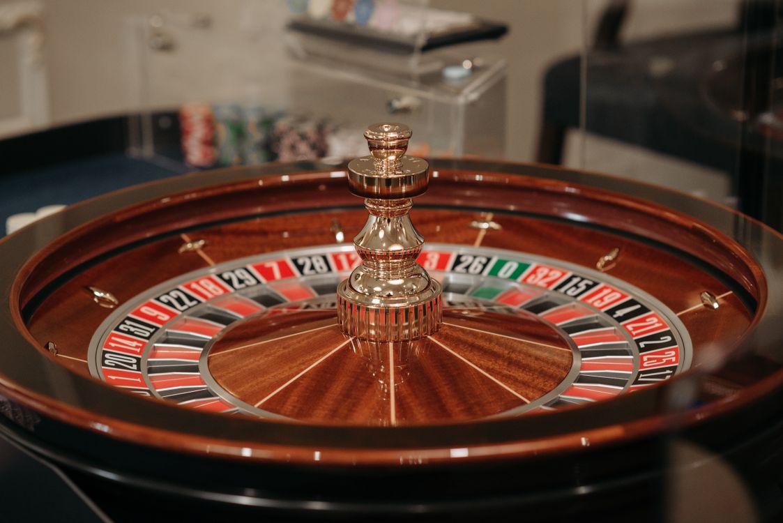 Person playing casino games on a laptop at home