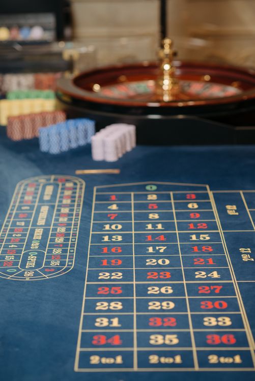 Person playing online casino games on a laptop