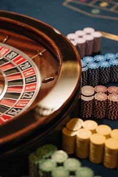 Close-up of a roulette table with colorful chips at a casino.