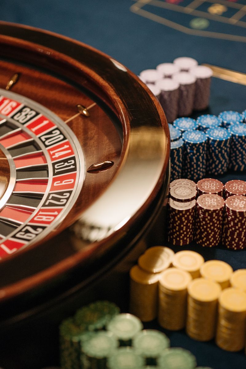 Close-up of a roulette table with colorful casino chips
