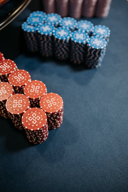 Free Colored Coded Gambling Chips in a Game of Roulette Stock Photo
