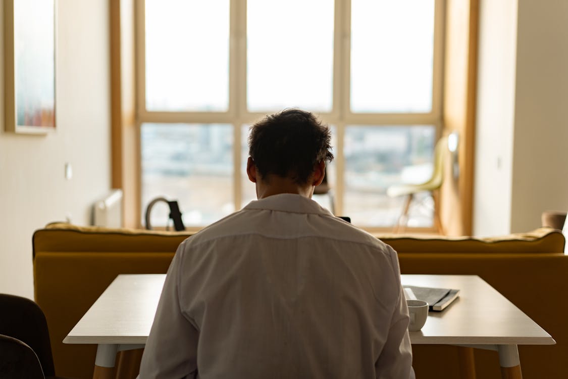 Free Back View of a Man in White Long Sleeve  Stock Photo
