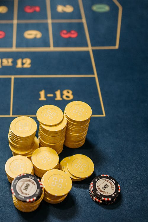 Free Casino Gambling Chips in the Roulette Game Table Stock Photo