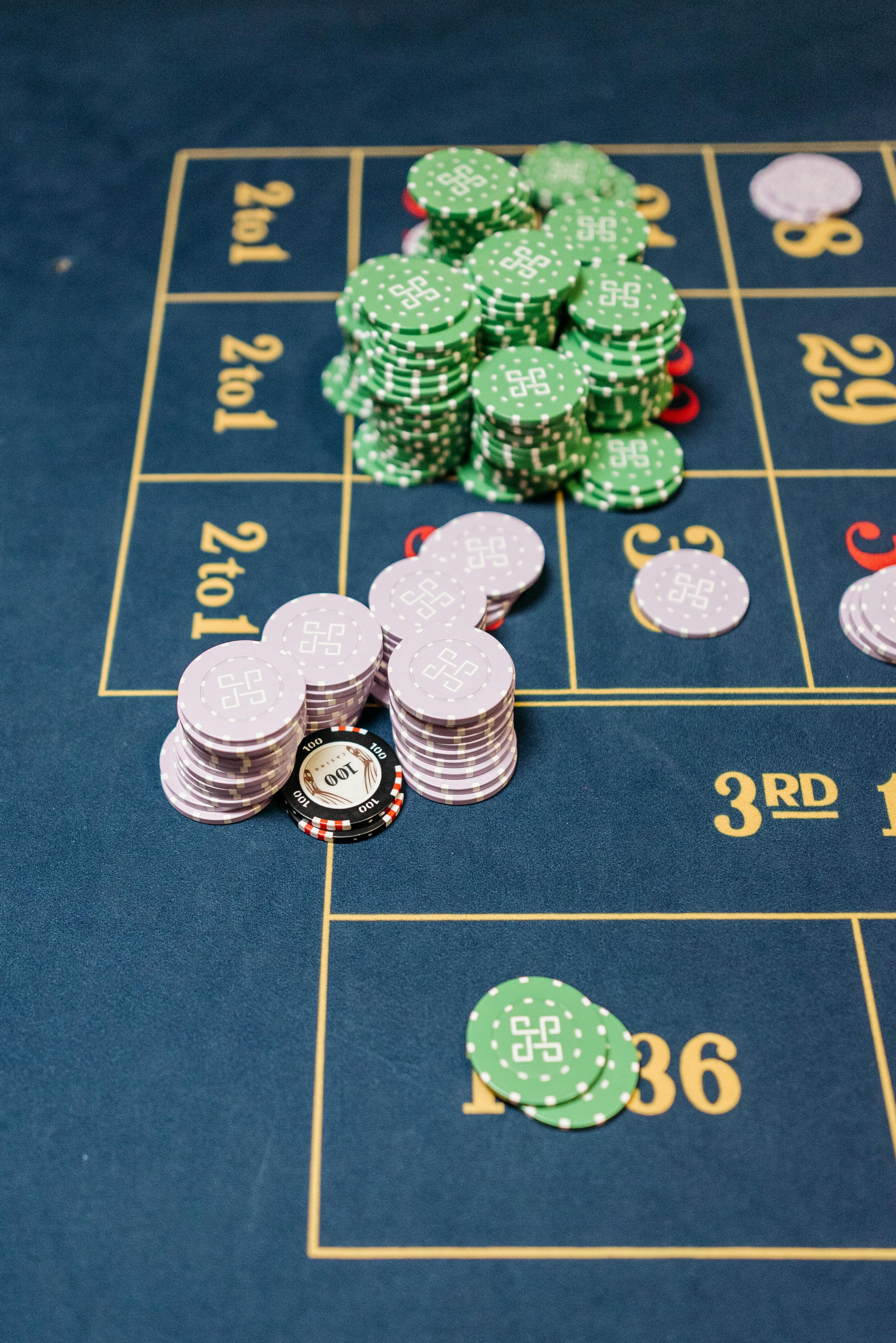 casino tokens on a roulette table