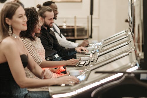 Free People Playing Slot Machines Stock Photo