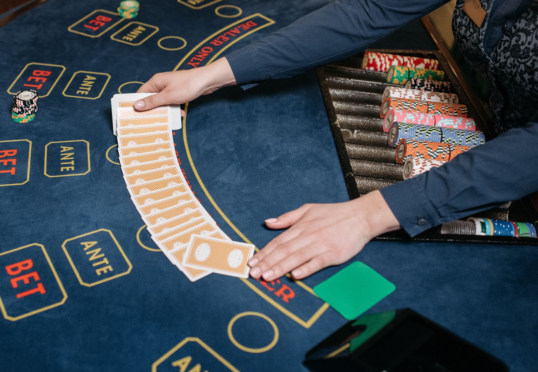 A baccarat table with cards and chips laid out