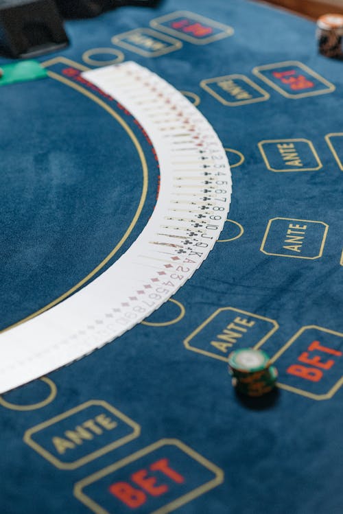 Playing Cards Spread Over the Poker Table